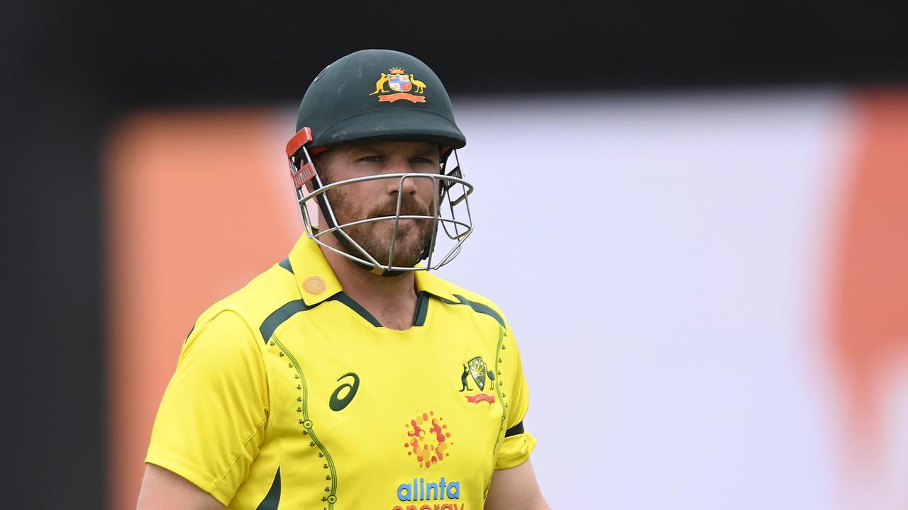 Aaron Finch of Australia walks from the field. Photo by Ian Hitchcock/Getty Images