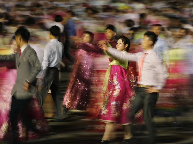 A mass dance in Pyongyang. A generational divide is quietly growing in North Korea, often hidden behind relentless propaganda. Picture: Wong Maye-E/AP