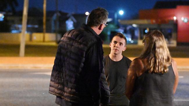 Irons talks to Hedley Thomas and Shandee Blackburn’s mum Vicki after he reenacts the alleged killer’s run. Picture: Lyndon Mechielsen