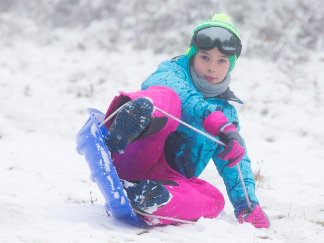 Jade Bubleinik, 9 from Werribee tobogganing at Mount Macedon. Picture: Sarah Matray