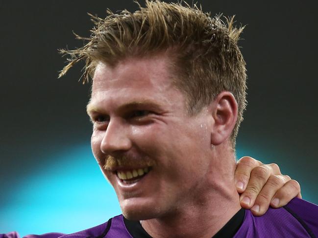 PERTH, AUSTRALIA - JANUARY 18: Matthew Wade of the Hurricanes shares a moment with James Faulkner while walking from the field after winning the Big Bash League match between the Perth Scorchers and the Hobart Hurricanes at Optus Stadium on January 18, 2019 in Perth, Australia. (Photo by Paul Kane/Getty Images)