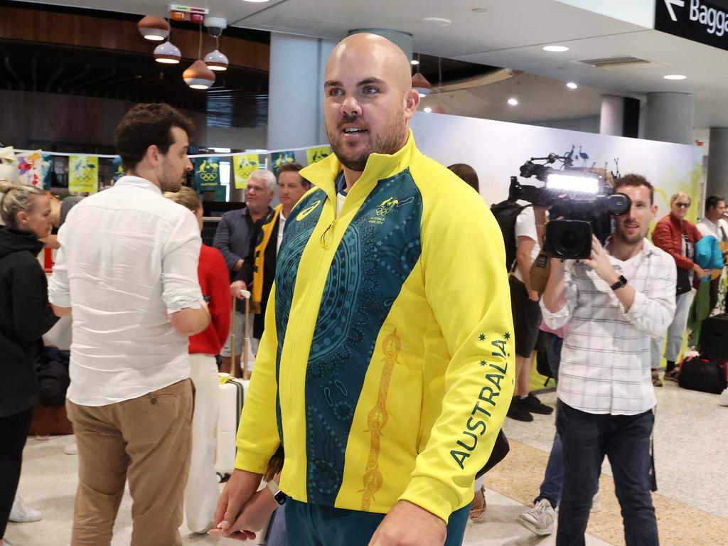 Matt Denny, Queensland Olympians arriving home to Brisbane, Airport. Picture: Liam Kidston