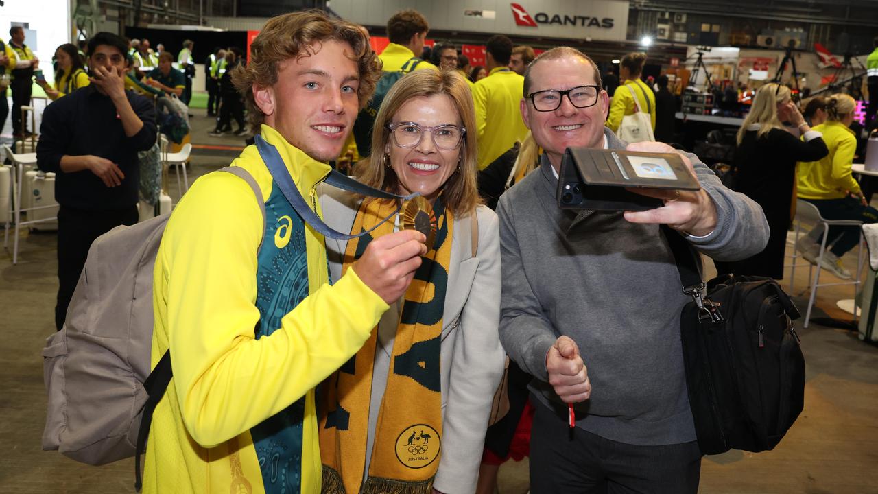 Skateboarder Keegan Palmer with his fold medal and proud family. Picture: Rohan Kelly