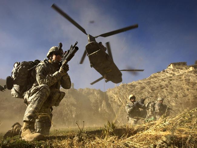 This file photo taken on 20/11/2008 shows US Army soldiers from 2-506 Infantry 101st Airborne Division and Afghan National Army soldiers taking positions after racing off the back of a UH-47 Chinook helicopter during the launch of Operation Shir Pacha into the Derezda Valley in the rugged Spira mountains in Khost province, along the Afghanistan-Pakistan border, directly across the border from Pakistan's lawless Waziristan region.