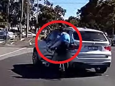 Dashcam footage has captured the moment a cyclist was thrown from his bike after being hit by the BMW on the Princess Highway.