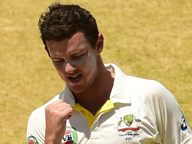 Australia's Josh Hazlewood celebrates after taking the wicket of West Indies' Jason Holder on LBW to end the innings, on day three of the second cricket Test between Australia and the West Indies, June 13, 2015 at Sabina Park in Kingston, Jamaica. AFP PHOTO / ROBYN BECK