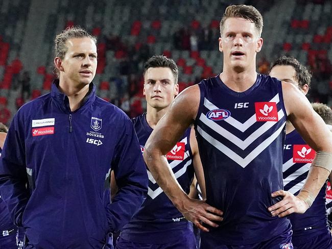 Nat Fyfe (left) and Matt Taberner of the Dockers leave the field following the Round 4 AFL match between the Gold Coast Suns and the Fremantle Dockers at Metricon Stadium on the Gold Coast, Saturday, June 27, 2020. (AAP Image/Dave Hunt) NO ARCHIVING, EDITORIAL USE ONLY