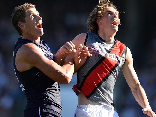 Joe Daniher takes on Aaron Sandilands in the ruck. Picture: Daniel Wilkins