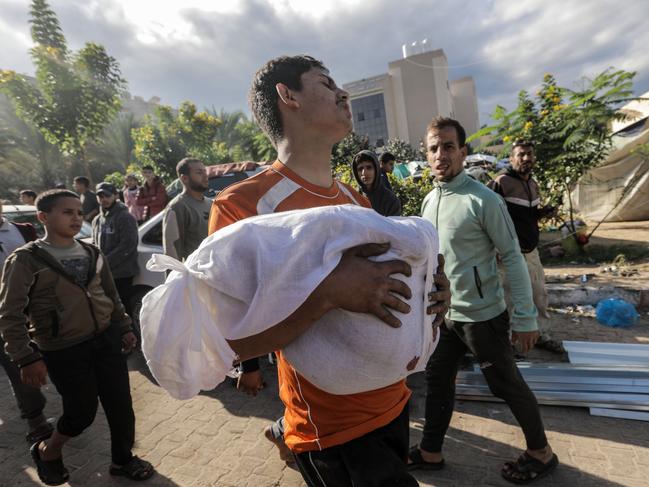 People mourn as they collect the bodies of Palestinians killed in Israeli raids in Khan Yunis, Gaza. Picture: Getty Images