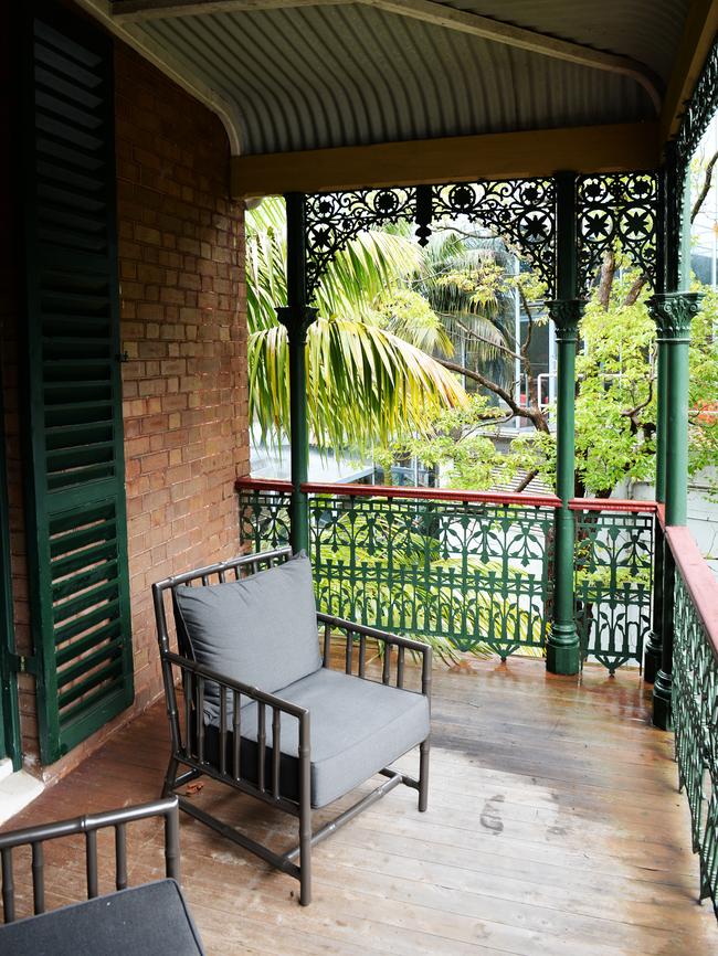 Heritage features include the wrought-iron verandah.