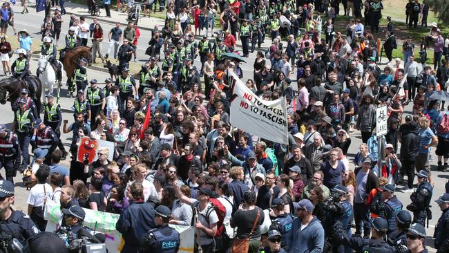 Left-wing and far-right wing protesters spill on to St Kilda Esplanade. Picture: AAP