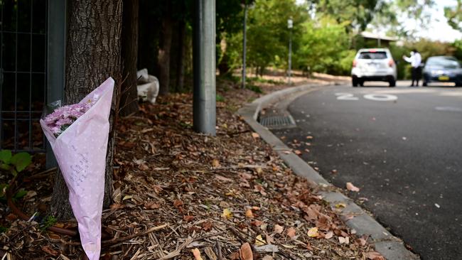 Flowers left outside the Anglicare Newmarch House in Western Sydney on Sunday as staff monitor cars entering and exiting the home. Picture: AAP