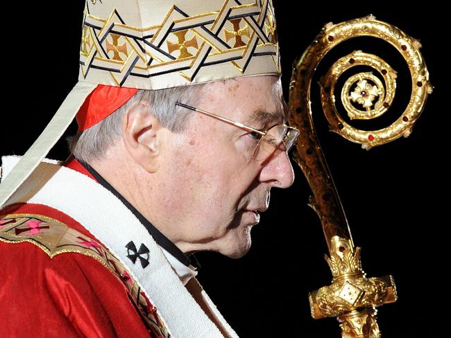 (FILES) This file photo taken on July 14, 2008 shows Cardinal George Pell officiating the opening mass of World Youth Day (WYD), in Sydney. Cardinal George Pell said on June 29, 2017 that he would take a leave from the Vatican to return to Australia to fight child sex abuse charges after being given strong backing from Pope Francis, who has not asked him to resign from his senior Church post. / AFP PHOTO / WILLIAM WEST