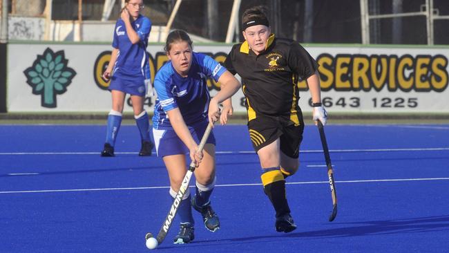 GIVING CHASE: Reece Winters of Barbs Kookaburras (right) chases Sailors Grafton Air's Laura Hennesey in the 2019 under-16 GHA grand final.