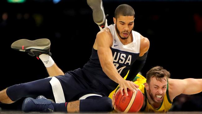 Team USA’s Jayson Tatum and the Boomers’ Nicholas Kay compete for the ball in Melbourne on Saturday night. Picture: Stuart McEvoy/The Australian