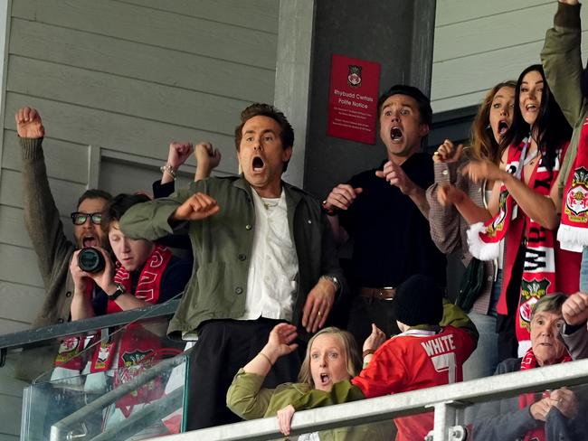 Wrexham co-owners Ryan Reynolds and Rob McElhenney celebrate after Wrexham scored a goal. Picture: Martin Rickett