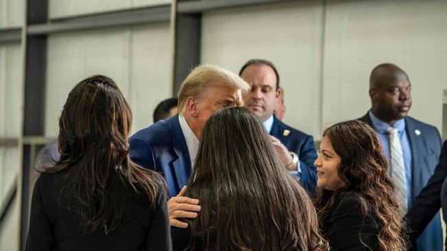 Donald Trump greets Gloria Guillen and Mayra Guillen, mother and sister of murdered US Army soldier Vanessa Guillen, after they disputed allegations made in The Atlantic. Picture: AFP