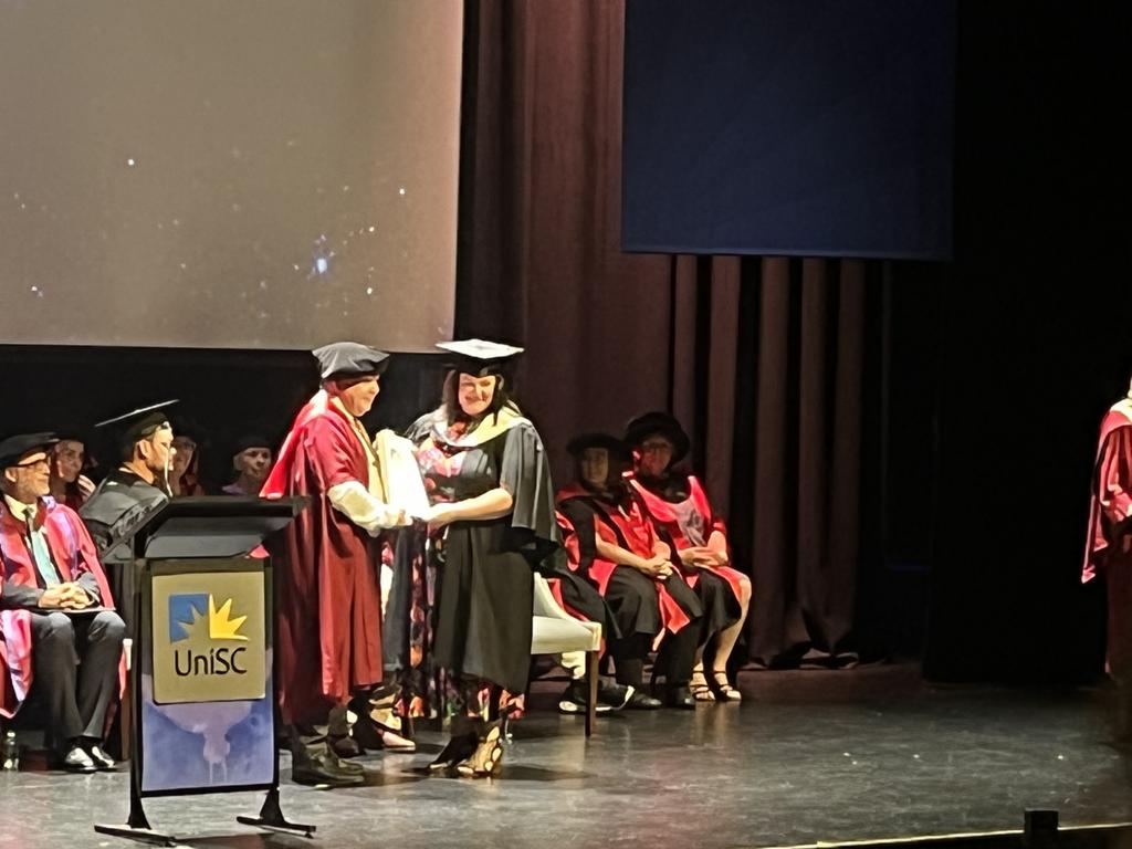 Graduates from the University of the Sunshine Coast's Fraser Coast campus celebrating at the Brolga Theatre.