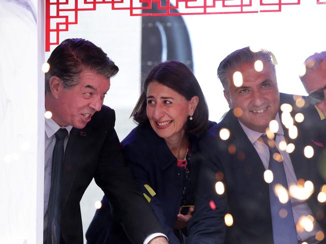 NSW Premier Gladys Berejiklian and MP Ray Williams and Fairfield mayor Frank Carbone cutting a cake at the Cabramatta Moon Festival. Picture: Jonathan Ng