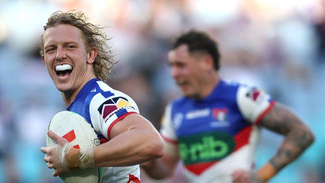 Phoenix Crossland of the Knights makes a break and scores a try during the round 18 match. Photo by Jeremy Ng/Getty Images