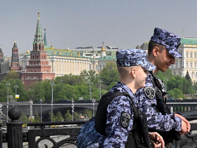 Russian National Guard (Rosgvardia) servicemen patrol a bridge along the Moskva river in front of the Kremlin in Moscow on April 23, 2025. Vladimir Putin has offered to halt Russia's invasion of Ukraine on the current front line, the Financial Times reported Tuesday, as Donald Trump seeks to make good on his promise to end the three-year conflict. (Photo by Alexander NEMENOV / AFP)