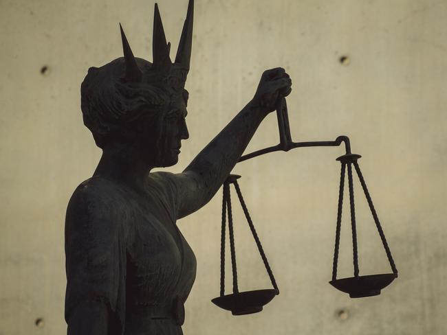 BRISBANE , AUSTRALIA - NewsWire Photos - BRISBANE , JUNE 24 2024: Generic photo of the scales of justice stature outside Brisbane Supreme Court in the Brisbane CBD. Picture: NewsWire / Glenn Campbell