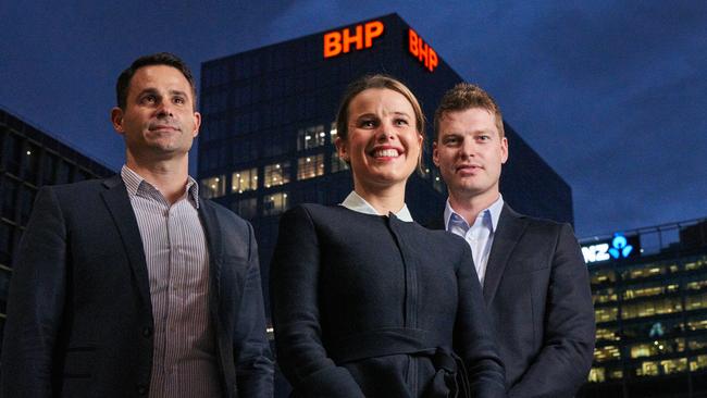 George Roussos from Charter Hall (left) with Lisa Phillips and Lachlan Wicks from BHP in front of the new GPO Exchange tower in Adelaide. Picture: MATT LOXTON