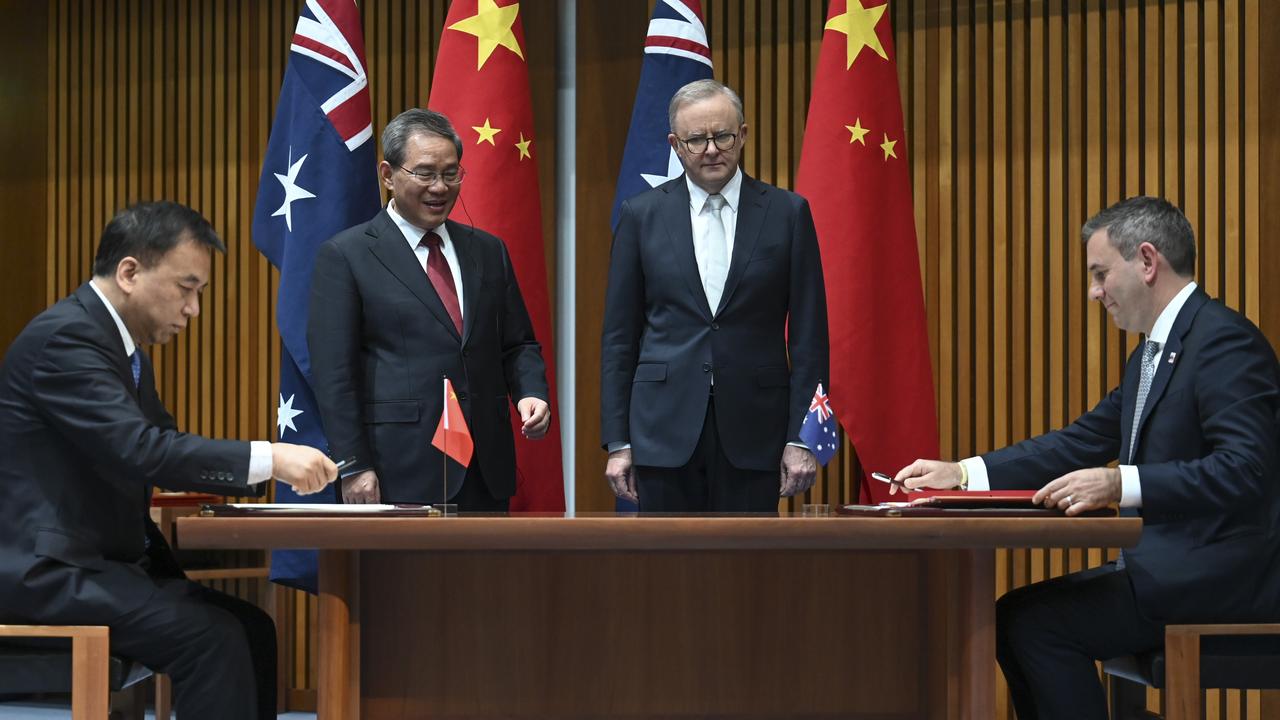Federal Treasurer Jim Chalmers joins Prime Minister Anthony Albanese and Chinese Premier Li Qiang during a signing ceremony at Parliament House in Canberra. Picture: NewsWire / Martin Ollman