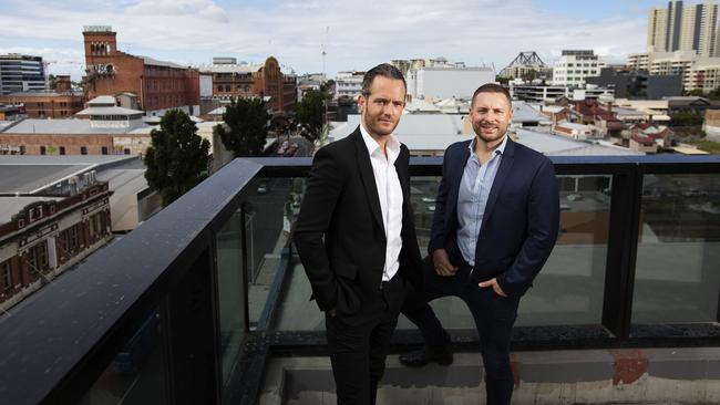 Tim Gurner from Gurner and James Sinclair from SHG show off the view from their new rooftop bar Altitude at Foresters in Fortitude Valley. Picture: Attila Csaszar/AAP