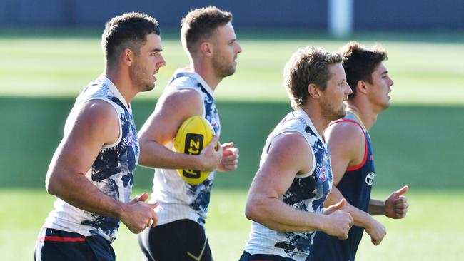 Taylor Walker, who has just returned from injury, with injured trio Brodie Smith, Rory Sloane and Riley Knight. Picture: AAP Image/David Mariuz