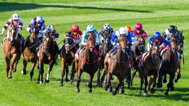 The 2023 Cox Plate field, featuring winner Romantic Warrior (fifth from left), swings for home at The Valley last year. Picture: Jay Town / Racing Photos