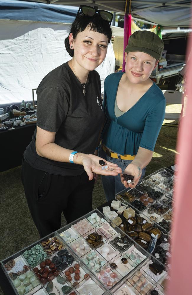 Crystal lovers Kelsey Hagger (left) and Chelsea Moore look for treasures at the Time Keeper Crystals stall at Gemfest hosted by Toowoomba Lapidary Club at Centenary Heights State High School, Saturday, October 21, 2023. Picture: Kevin Farmer