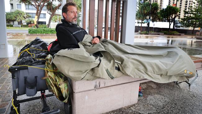 Gold Coast starting to feel the wrath of Cyclone Alfred, lurking just off the coast. Homeless man Nico Jones shelters from the weather in his swag at Surfers Paradise. Picture Glenn Hampson