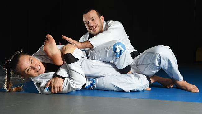 Livia Gluchowska restrains fiancee Lachlan Giles with a knee bar. Picture: Josie Hayden