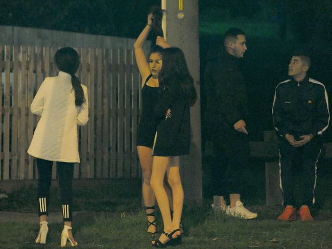 Bystanders at the scene of the party. Picture: Andrew Henshaw