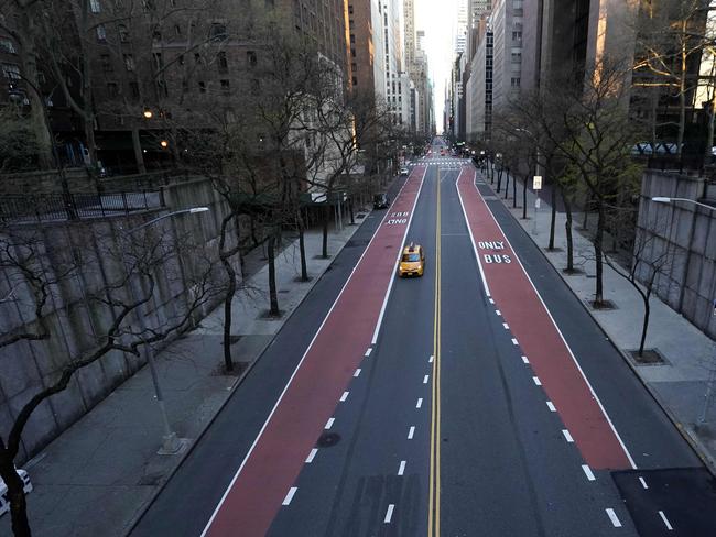 Aside from a lone yellow cab, New York’s usually bustling 42nd Street is empty on a warm spring Sunday. Picture: AFP