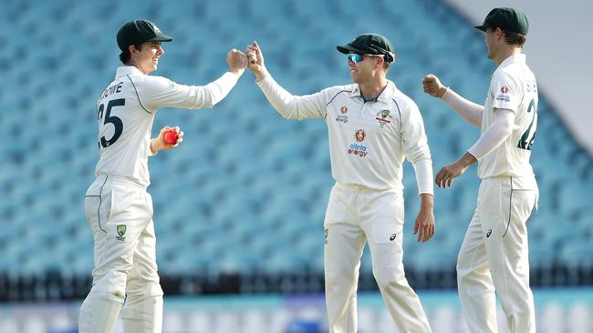 Patrick Rowe is congratulated on his catch to dismiss Mayank Agarwal by Marcus Harris during Day 2 of India v Australia A day/night tour match at the SCG. Picture. Phil Hillyard