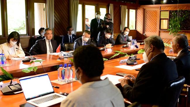 Secretary-General of the Pacific Islands Forum Henry Puna, far right, holds a meeting with Chinese Foreign Minister Wang Yi, second left, in Suva on Monday. Picture: AFP