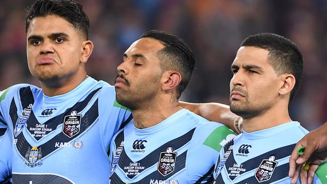 LtoR; Blues players Josh Morris, Latrell Mitchell, Josh Addo-Carr, Cody Walker and Damien Cook are seen during the Australian National Anthem prior to Game 1 of the 2019 State of Origin series between the NSW Blues and the Queensland Maroons at Suncorp Stadium in Brisbane, Wednesday, June 5, 2019. (AAP Image/Dave Hunt) NO ARCHIVING, EDITORIAL USE ONLY