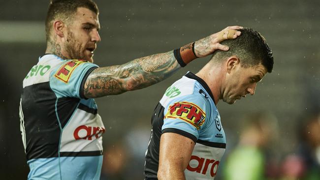 SYDNEY, AUSTRALIA - MARCH 21: Chad Townsend of the Sharks is embraced by Josh Dugan of the Sharks after missing a kick for goal during the round two NRL match between the Cronulla Sharks and the Canberra Raiders at Netstrata Jubilee Stadium, on March 21, 2021, in Sydney, Australia. (Photo by Brett Hemmings/Getty Images)