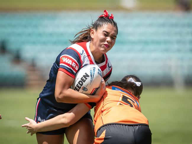 Tyra Ekepati is hit hard by Stephanie Goodworth. Picture: Julian Andrews