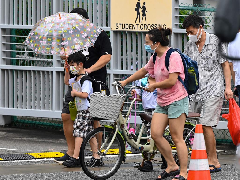 Masks are still a critical part of Singapore’s Covid-19 prevention plan, and are mandatory for all persons six and above when leaving the home. Picture: Roslan Rahman / AFP.
