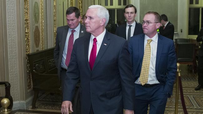 Vice President Mike Pencedeparts with White House senior adviser Jared Kushner, and incoming White House Chief of Staff Mick Mulvaney as they depart for the night without a bill that would pay for President Donald Trump's border wall.