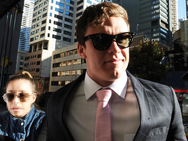 Zane Alchin arrives at the Downing Centre court in 2016 with then girlfriend Rebecca who alleges he destroyed her property. Picture: Joel Carrett.