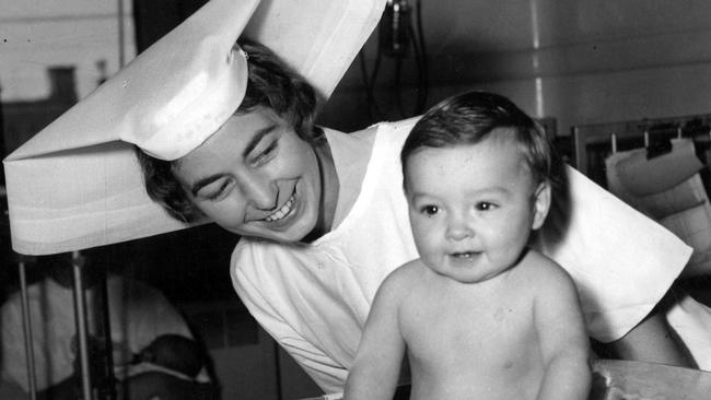 04/1962. Even little Rodney, a young patient at the Royal Children's Hospital, seems pleased with his weight as he is put on the scales by Sister Margaret Richmond.Rodney has just had an operation and he is getting the best of care until he recovers.You, too, can help the young patients by giving to The Sporting Globe-3DB- Good Friday Appeal held in aid of the hospital.[Herald 7/4/1962]Nurse. Nurses. Royal Childrens Hospital. Melbourne. (hsretro instagram 07/04/2023)