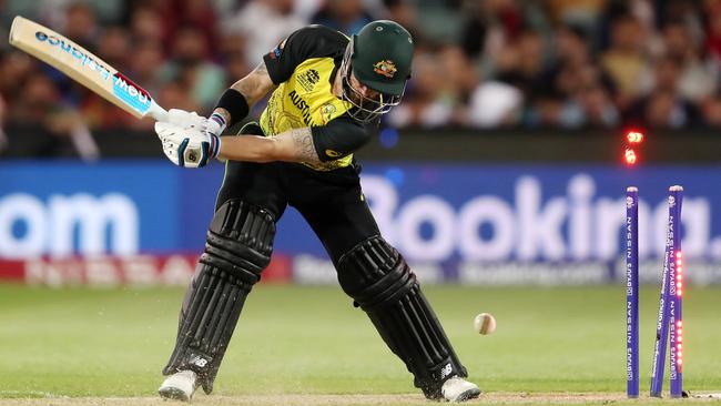 Matthew Wade of Australia bowled by Fazalhaq Farooqi for six. Photo by Sarah Reed/Getty Images