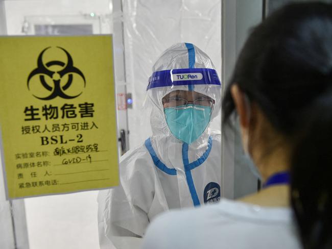 A medical staff member inside an isolation area at a temporary "Fire Eye" laboratory used for Covid-19 testing in Nanjing in China's eastern Jiangsu province. Picture: STR/AFP/China OUT