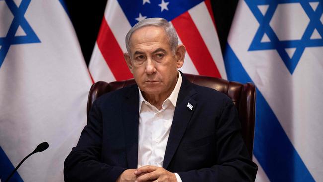 Benjamin Netanyahu waits for the start of the Israeli war cabinet meeting also attended by the US President, in Tel Aviv. Picture: AFP.