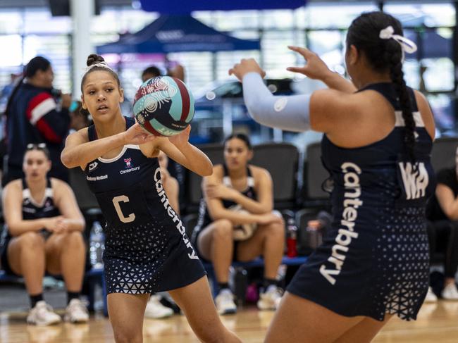 Canterbury College (navy blue) vs. Xavier Catholic College (black and gold). Canterbury CollegeÃ¢â&#130;¬â&#132;¢s Aaliyah Frescon-Sheppard makes a pass.