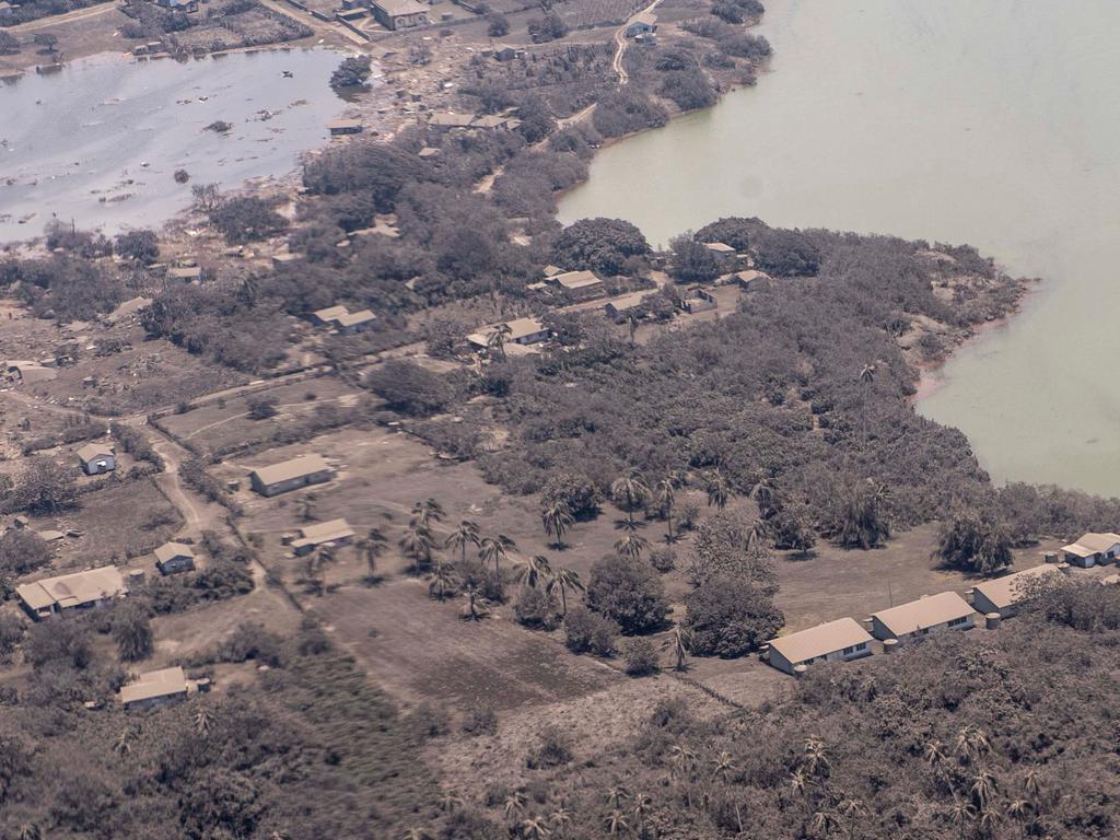 Ash on the roofs of homes and surrounding vegetation, after the eruption of the Hunga-Tonga – Hunga-Haa'pai volcano. Picture: AFP